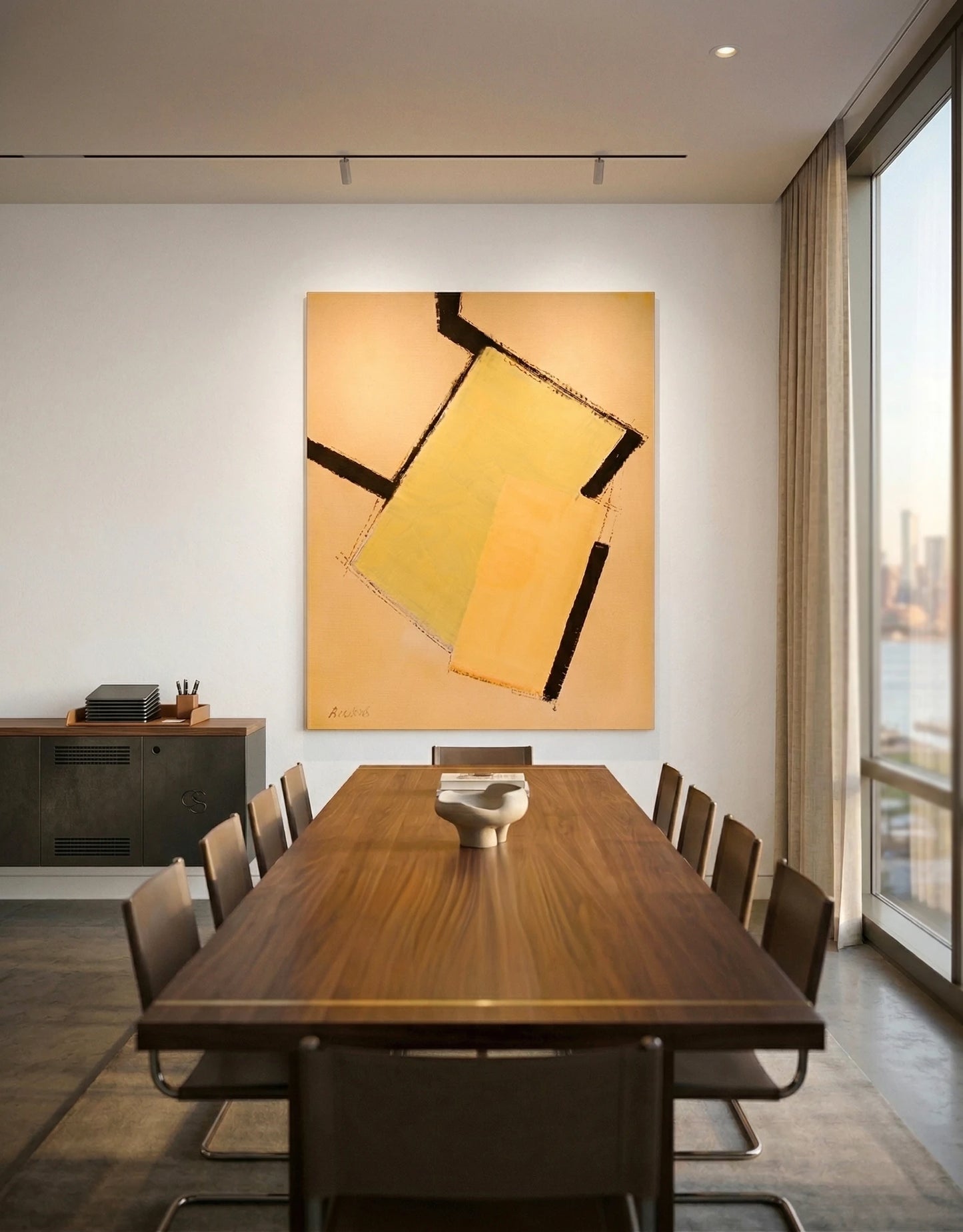 Abstract painting by Annabel Andrews displayed in a modern meeting room, geometric artwork in orange and ochre tones